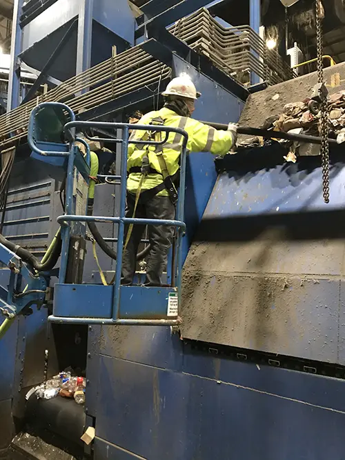 Cleaning a Waste Recycling Center.